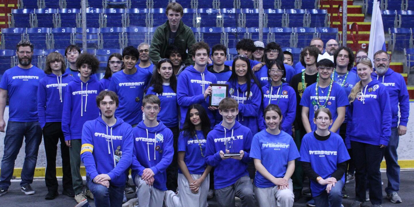 A photos showing the Oyster River High School FIRST Robotics team with their award.